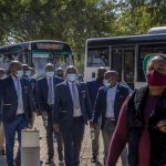 Leeto team of employees going into the bus