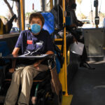 Person with disability in the bus using wheelchair