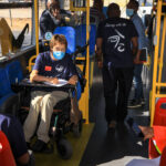 Person with disability in the bus using wheelchair 2