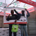 Passengers at activation displaying hampers