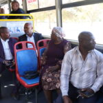 Passengers enjoying the bus ride with mayor 2