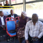 Passengers enjoying the bus ride with mayor 3