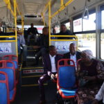 Passengers enjoying the bus ride with mayor 4