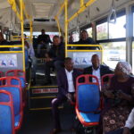 Passengers enjoying the bus ride with mayor 5