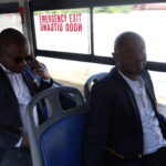 Men enjoying the bus ride