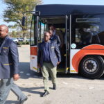 Passengers leaving the bus 13